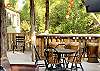 Pavilion cigar lounge sofa, poker table and bar.