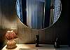The sultry bathroom matches the bedroom.