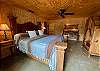Large Mexican armoire, rustic bench and touch wall light add drama.