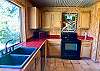 Kitchen #2 has plenty of counter space for multiple cooks in the kitchen. Authentic red Mexican tile & hand painted mural.