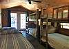 A GREAT BUNKROOM WITH 2 SETS OF TWIN BUNK BEDS, 2 TWIN BEDS, VAULTED CEILING, FAN, COLD A/C, FRENCH DOORS, BENCH, STORAGE.