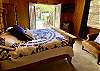 Poolside Bedroom 2 is a perfect oasis for a family.  1 Queen bed, 2 twin bunks and 2 comfy suede chairs. 