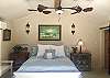 VAULTED CEILING, WALL SCONES FROM MEXICO, MIRRORED NIGHT STAND, BENCH, DOUBLE FAN, FLAT SCREEN TV, ART, SLIDING BARN DOOR TO BATH.