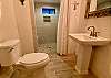 Bunk room bathroom 3 is light and bright..