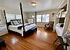 King bed, custom built-in twin bunk beds, wood floors, light filled.
