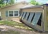 Handsome plantation shutters are a stylish exterior detail to the Sunroom.