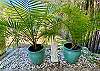 Cabana has tropical palms and garden statues that add character.