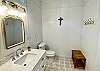 Bunkhouse bathroom is light, bright and beautiful. Vaulted ceiling, marble counters, tile floors.