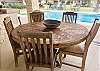 CUSTOM RUSTIC WOOD TABLE & CHAIRS PROVIDE POOLSIDE DINING.