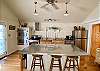 Huge island, vaulted ceiling, 2 sets french doors, covered porch, bathroom, bedroom.