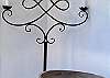 Elegant poolside wrought iron candelabra.