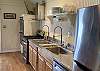 High end appliances, commercial sink faucets and fully stocked with everything you need for family meals.