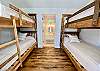 Bunkhouse bedroom has vaulted ceiling, wood floors, light & bright. Ensuite spa-like tile & marble bathroom.