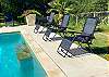 Lush tropical plants and palm trees. Underwater seating for relaxing in the pool.