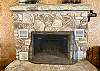 Rock fireplace in living room.