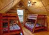 2 sets of bunkbeds with twin on top and doubles on bottom.  Wood floors, vaulted ceiling and en suite bathroom.