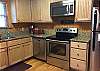 Kitchen has lots of storage, including a separate pantry.