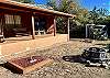 Great backyard covered porch with fire pit, horseshoes and awesome Frio River views!