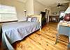 Bedroom 3 is an open, upstairs loft area has a comfy bed with dramatic views.