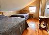 2 queen beds, hardwood floors, light & bright.
