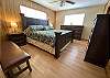 THE MASTER BEDROOM HAS WOOD FLOORS, HANDSOME FURNITURE, SPACIOUS AND ENSUITE BATHROOM.