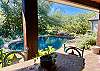 Lovely poolside patio with bar, 1/2 bath and picture perfect guest cabin.