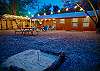 Outdoor fun include horse shoes, fire pit, party lights, hammock, charcoal smoker, picnic table and fire side lounge seating.