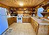 A super rustic river shack kitchen decorated with antiques.