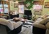 The living room has plenty of seating for everyone.