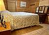 Bedroom 1 -  is spacious with tile floors, Queen bed, antiques.