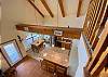 Open beam vaulted ceiling with staircase overlooking below.