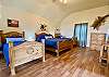 Bedroom 3 is a huge loft with wood floors, vaulted ceiling and ensuite bathroom.