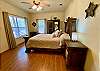 Master Bedroom 1 has wood floors, views, upscale decor and ensuite bathroom