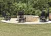Beautiful rockers by the custom rock firepit.