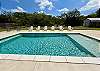 Stunning sundeck pool with beautiful outdoor furniture.