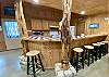 Cool kitchen bar with seating for 6. Check out the cedar trees!