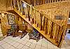 Custom cedar staircase leads to the huge upstairs loft.