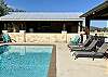 Lovely poolside with exceptional white rock Cabana.