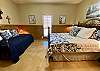 Texas sized Bedroom 2 has a King bed, twin trundle that sleeps 2. Bedroom has wainscotting, concrete floors and very nice accommodations.