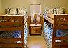 Bedroom 4 has 2 sets of Full size bunk beds.
Decor is bright, antique dresser with fresh bedding.