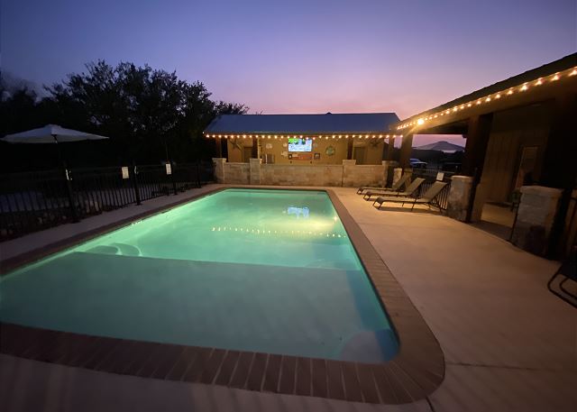 Night time is the best time to enjoy this stunning poolside entertainment area.