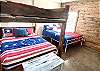Bedroom 4 is downstairs with 1 Queen Bunkbed, and 1 Queen Bed,