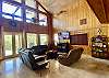 Living room has leather sofas, smart tv and awesome VIEWS.