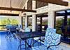 Upstairs outdoor covered porch with high top tables and chairs w/ cushions to take in the views.