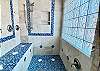 Luxury Couples Shower with 2 shower heads and bench seating.