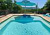 Stunning views from the heated pool with sun deck, massive umbrella and in-pool water lounge chairs. Underwater seating around entire pool.