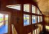 At the upstairs landing is the 2nd story windows overlooking the beautiful mountain views from the covered porch.