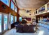 French doors lead to the covered porch and 30' vaulted ceilings for serious drama.