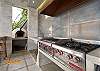 outdoor kitchen with 4 burners, grill, pizza oven, ice maker