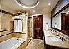Double sink, luxury shower and bath tub.